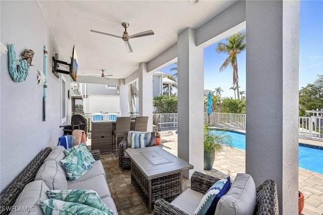 view of patio with outdoor lounge area and ceiling fan