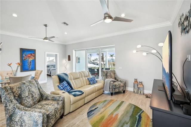 living room featuring ceiling fan, ornamental molding, and light hardwood / wood-style flooring