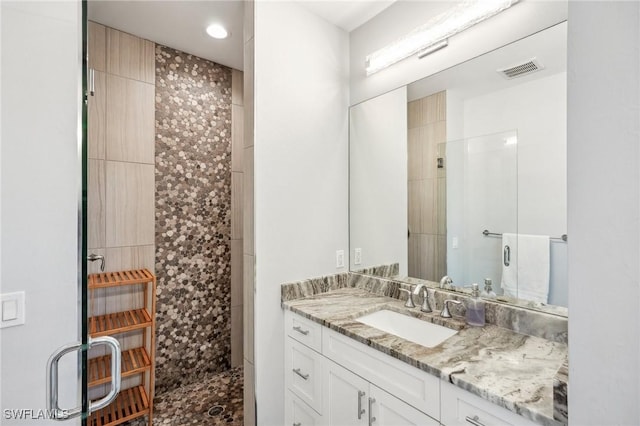 bathroom with vanity and walk in shower