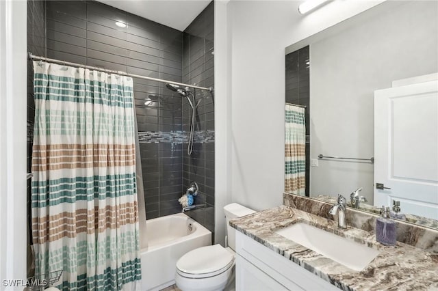 full bathroom featuring shower / tub combo with curtain, vanity, and toilet