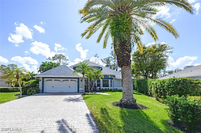 view of front facade featuring a garage and a front lawn