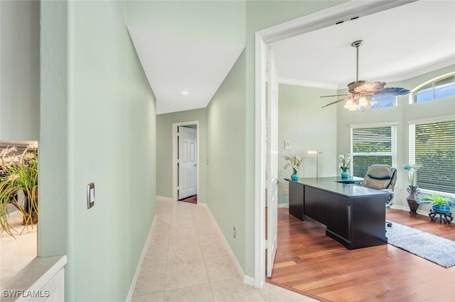 office with ornamental molding, ceiling fan, and light tile patterned flooring