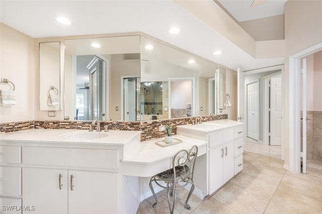 bathroom featuring tile patterned floors, a shower, vanity, ceiling fan, and backsplash