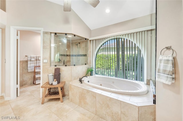 bathroom featuring lofted ceiling, ceiling fan, tile patterned flooring, tile walls, and separate shower and tub