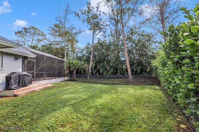 view of yard with a lanai