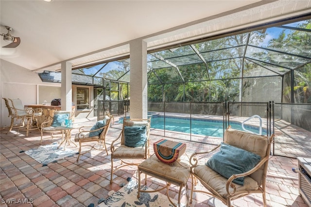 view of patio / terrace with a fenced in pool, exterior bar, and glass enclosure