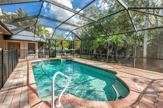 view of swimming pool featuring a patio area, an in ground hot tub, and glass enclosure