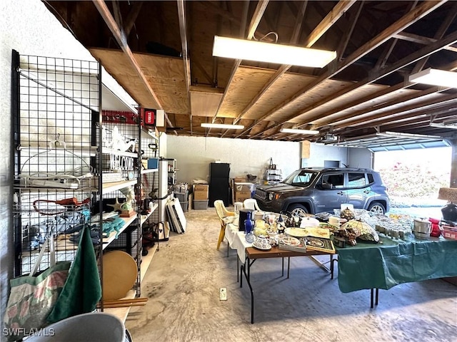 garage with black refrigerator