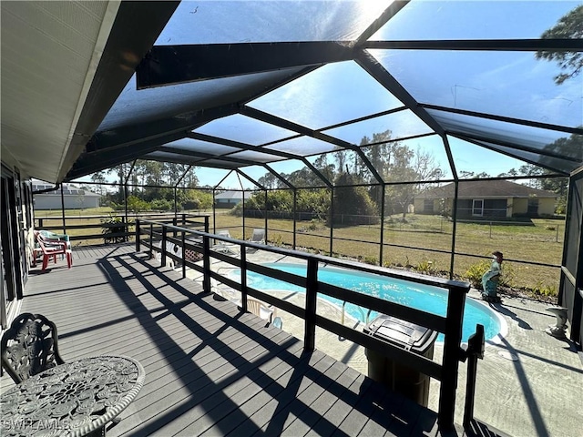 wooden deck featuring glass enclosure