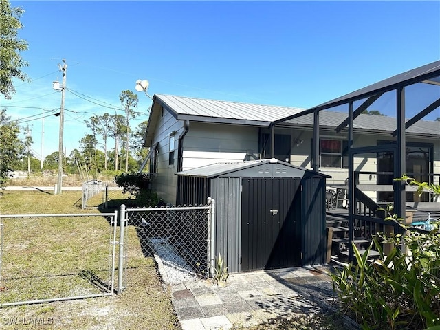 view of outbuilding with a lawn