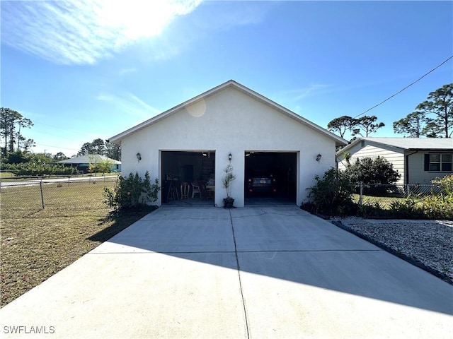 view of side of home featuring a garage and an outdoor structure