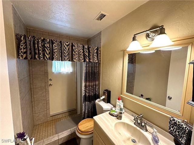 bathroom with vanity, toilet, and a shower with shower curtain