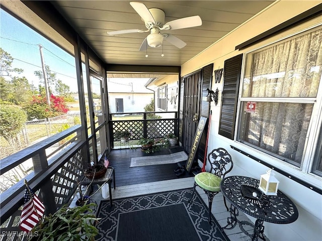 exterior space with ceiling fan