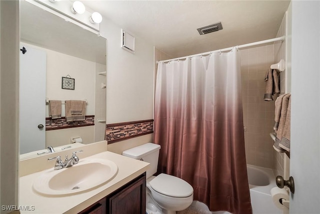 full bathroom with vanity, toilet, and shower / bath combo with shower curtain