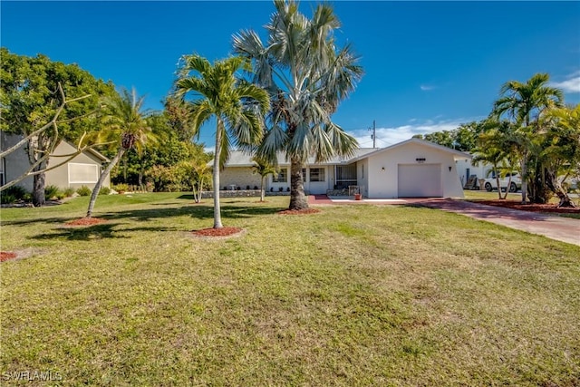 view of front of house with a garage and a front yard