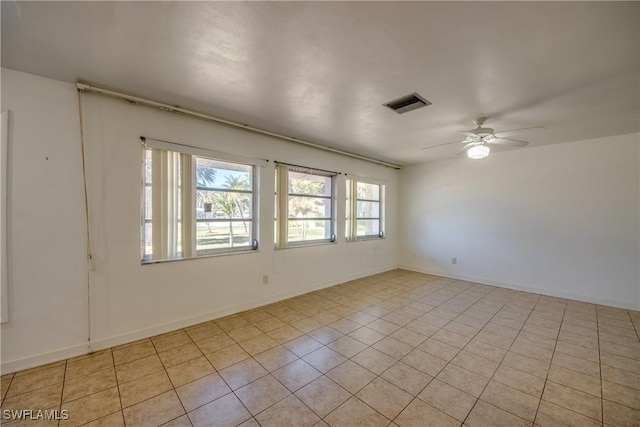 spare room with ceiling fan