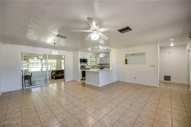 interior space with light tile patterned floors, sink, and ceiling fan