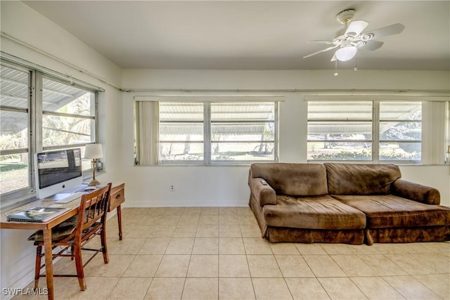 living room featuring light tile patterned flooring and ceiling fan