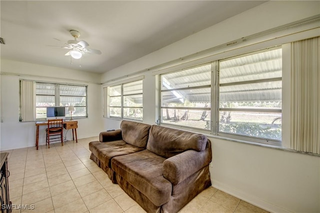 tiled living room featuring ceiling fan