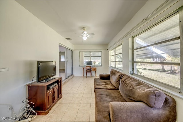 living room with light tile patterned flooring and ceiling fan