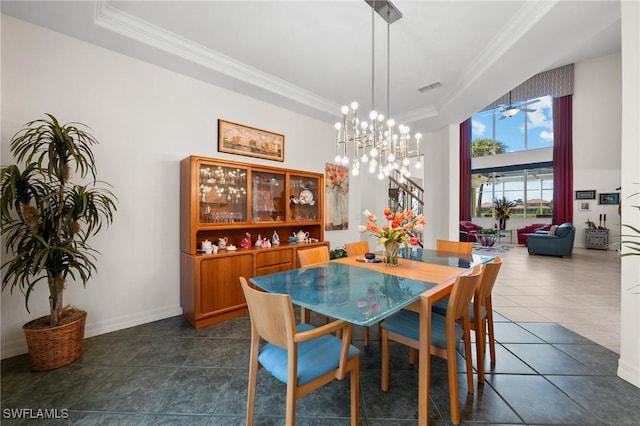 tiled dining area with an inviting chandelier, ornamental molding, and a raised ceiling