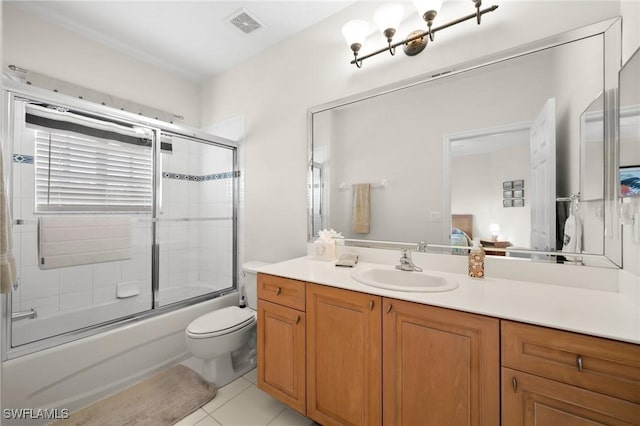 full bathroom with enclosed tub / shower combo, vanity, tile patterned floors, and toilet