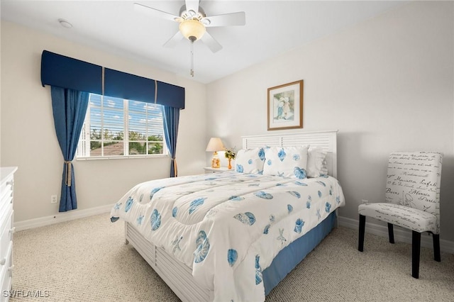 bedroom featuring light colored carpet and ceiling fan