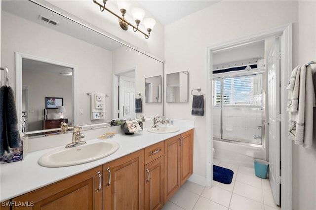 bathroom with vanity, bath / shower combo with glass door, and tile patterned floors