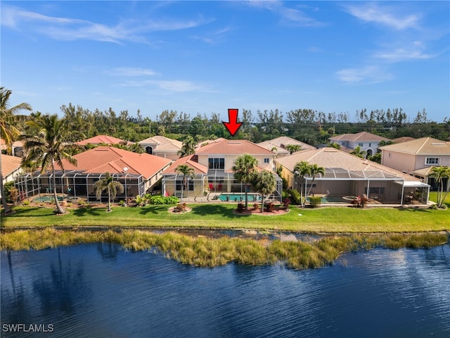 birds eye view of property with a water view