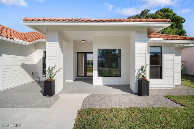 rear view of house featuring a patio