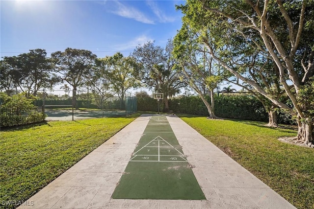 view of property's community featuring a yard