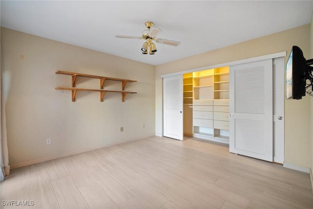 unfurnished bedroom with ceiling fan and light wood-type flooring