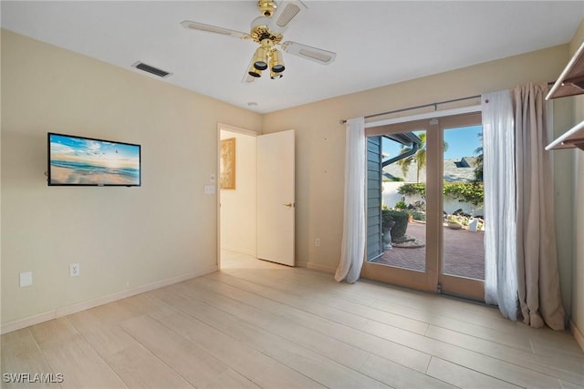 unfurnished room with ceiling fan and light hardwood / wood-style floors