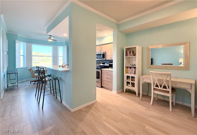 kitchen with a breakfast bar area, ornamental molding, stainless steel appliances, light hardwood / wood-style floors, and decorative backsplash