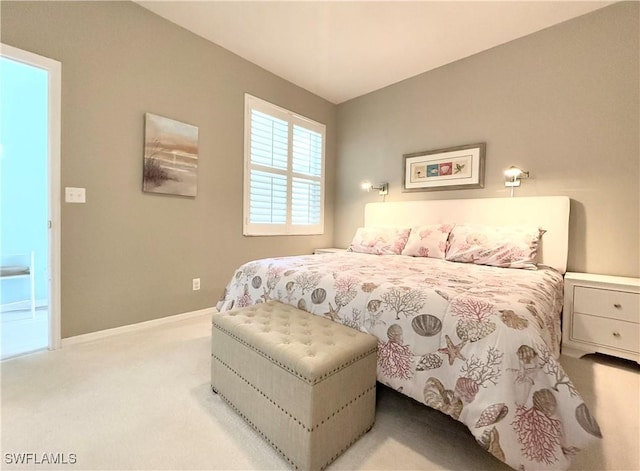 bedroom with light colored carpet