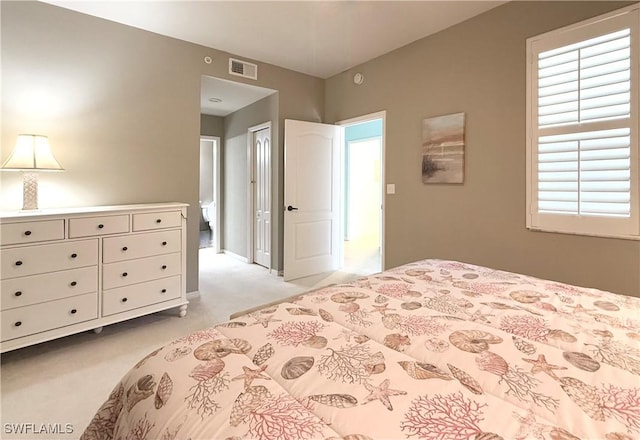 bedroom featuring light colored carpet