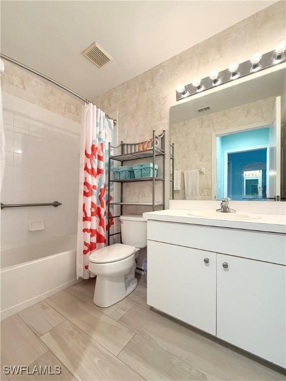 full bathroom with vanity, toilet, and shower / bath combo