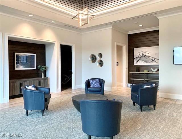 interior space featuring a raised ceiling, crown molding, and a chandelier