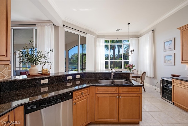 kitchen featuring dark stone countertops, sink, stainless steel dishwasher, and beverage cooler