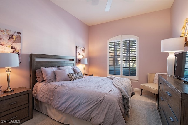 bedroom with ceiling fan and light carpet