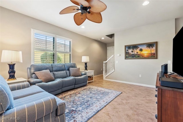 living room featuring light tile patterned floors and ceiling fan