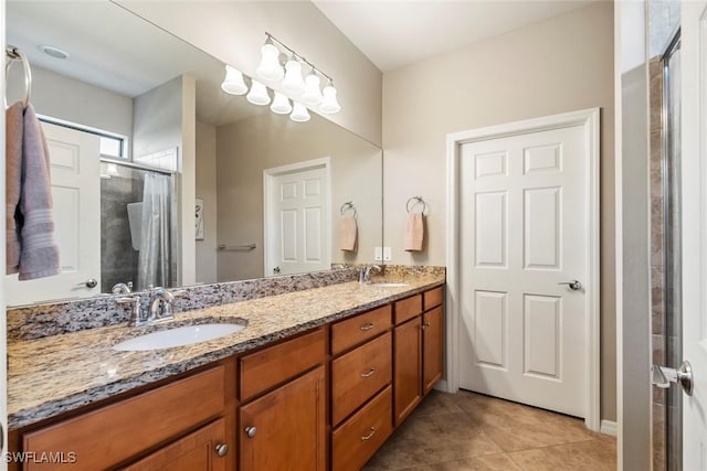 bathroom featuring tile patterned floors, vanity, and an enclosed shower