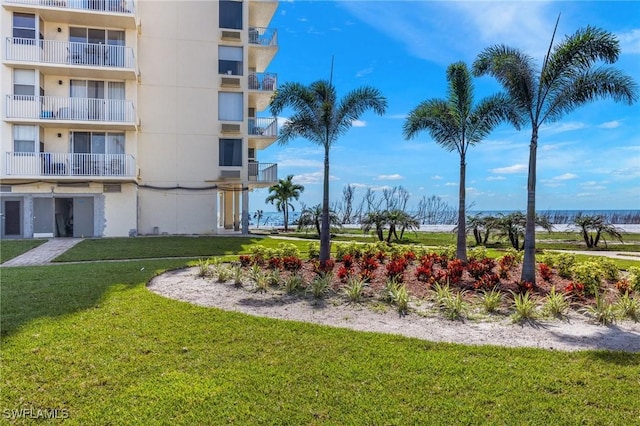 view of property's community with a lawn