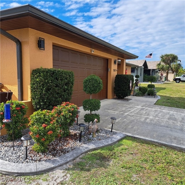 view of side of home featuring a garage