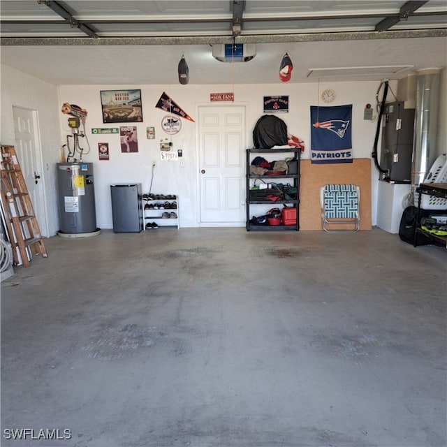 garage featuring a garage door opener and electric water heater