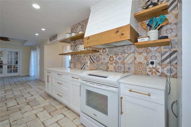 kitchen with electric stove, white cabinetry, tasteful backsplash, custom range hood, and french doors