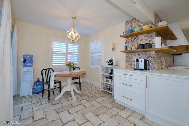 dining area featuring an inviting chandelier