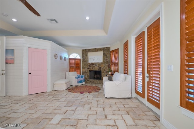 unfurnished living room featuring a stone fireplace