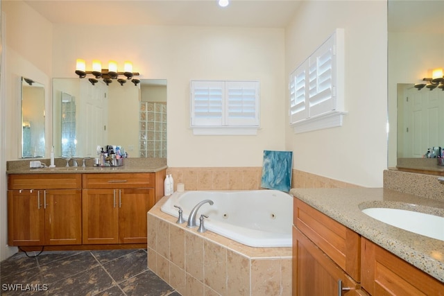 bathroom featuring vanity and tiled tub