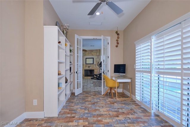 office space featuring ceiling fan and french doors